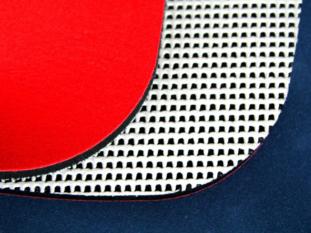 Cellular rubber sheets coated with textile (red) and anti-slip coating (white)